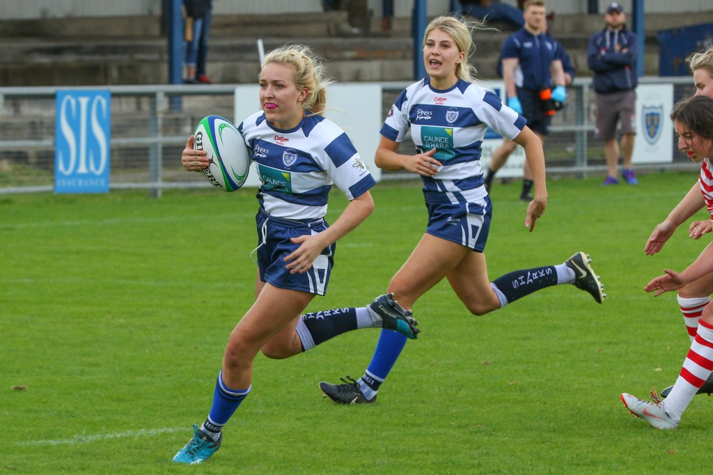 Meg Buckley breaks the Manchester line to score